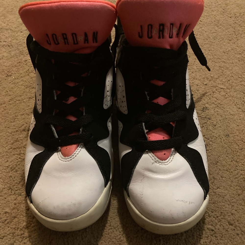 Size 6 Jordan’s. High top orange and white. Great condition.
